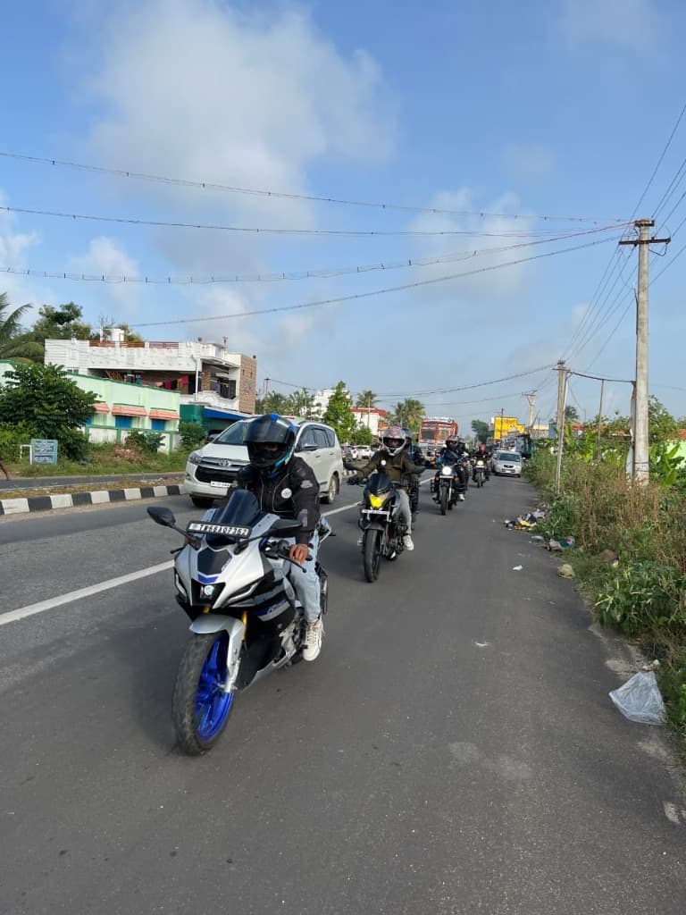 Motorcycle group riding along the open highway stretch