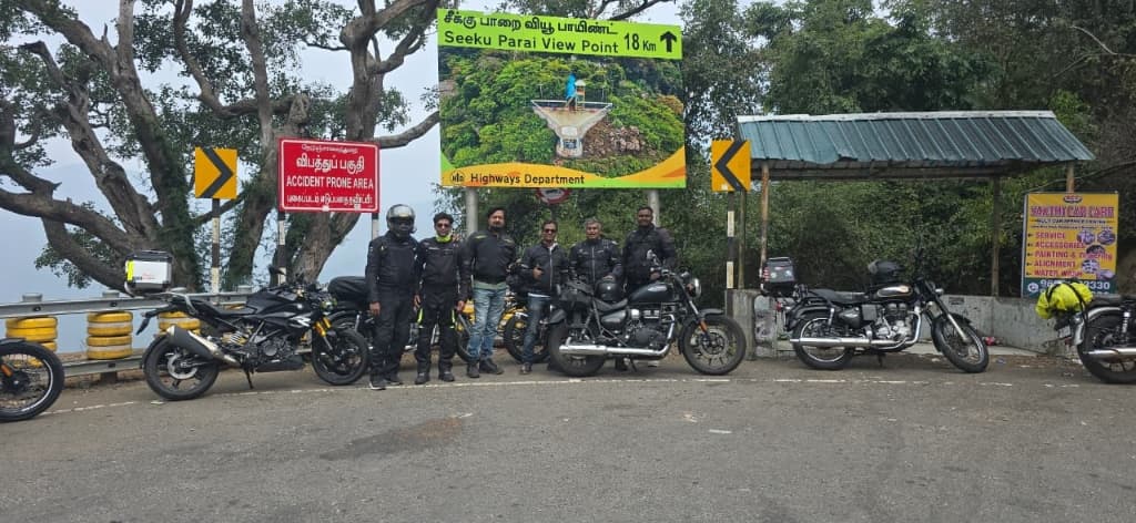 Group of riders with motorcycles parked at the Seeku Parai View Point sign