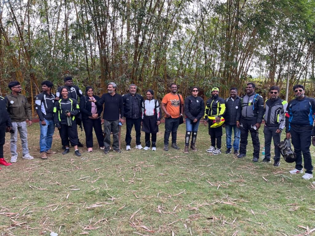 Infinite Wind Riders group photo gathered in a bamboo grove